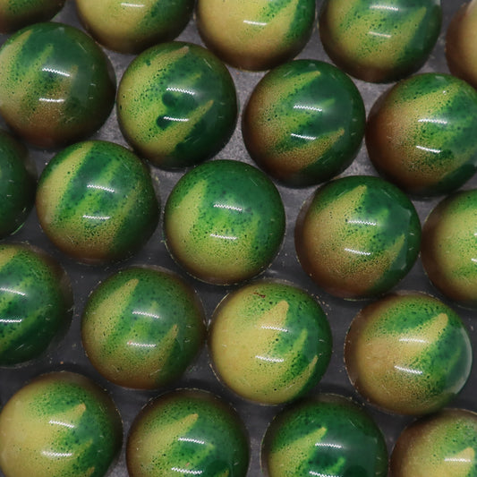 Overhead shot of array of green handmade chocolate bonbons