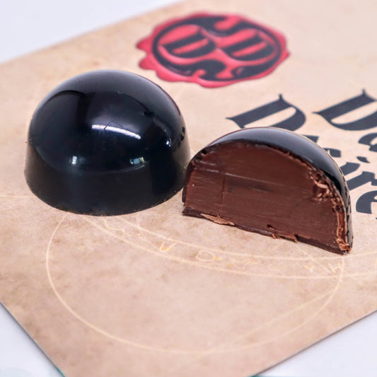 Cross-section of black luxury handmade chocolate bonbons  by Dark Desires