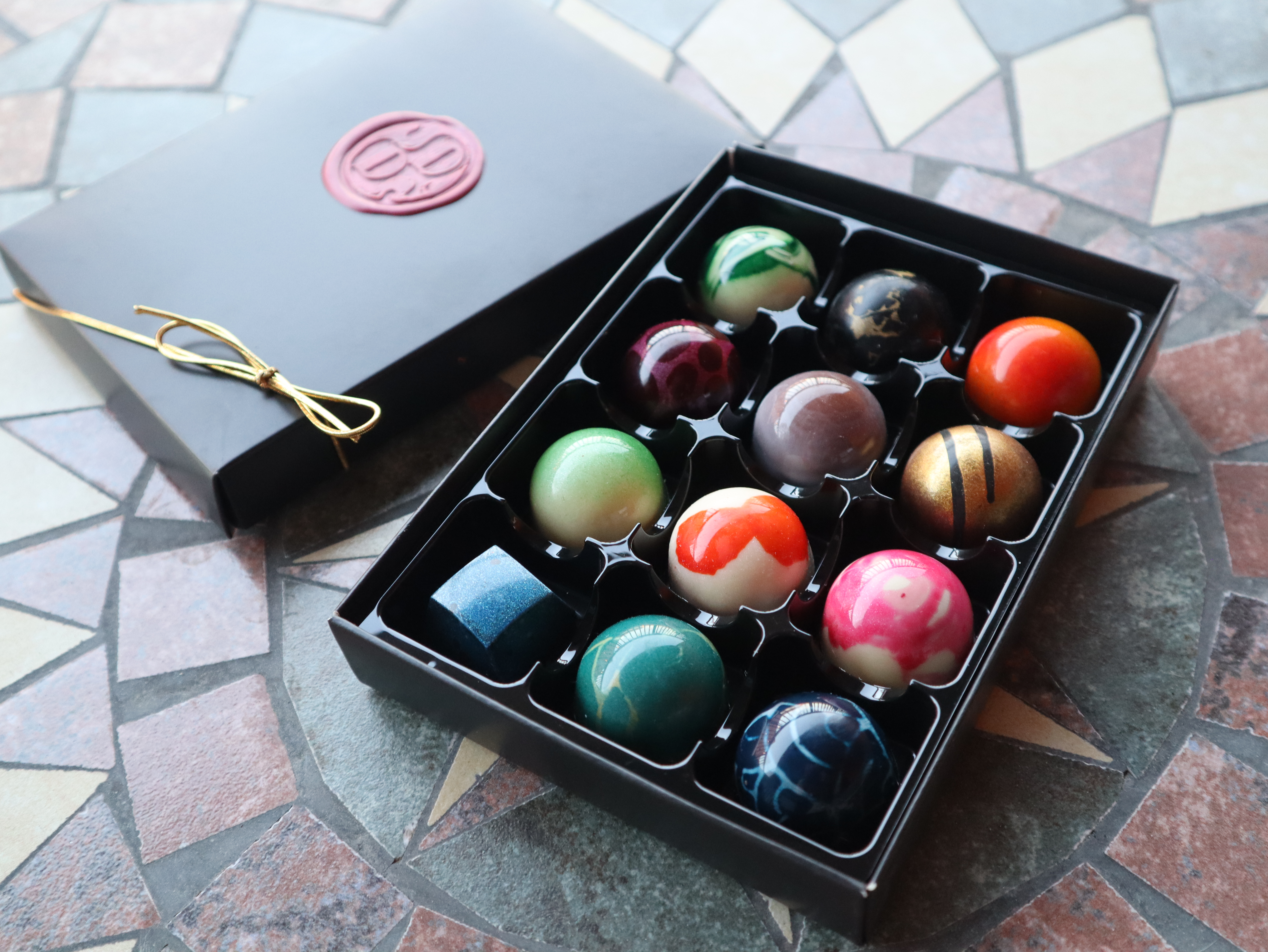 Box of luxury chocolate pralines in different flavours